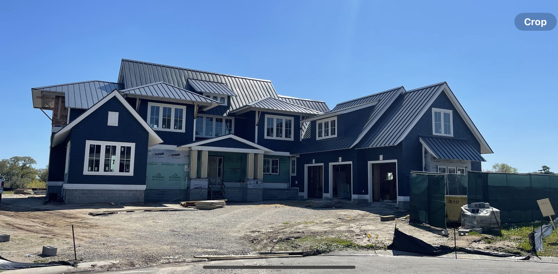 Aerial view of farmhouse with new metal roof