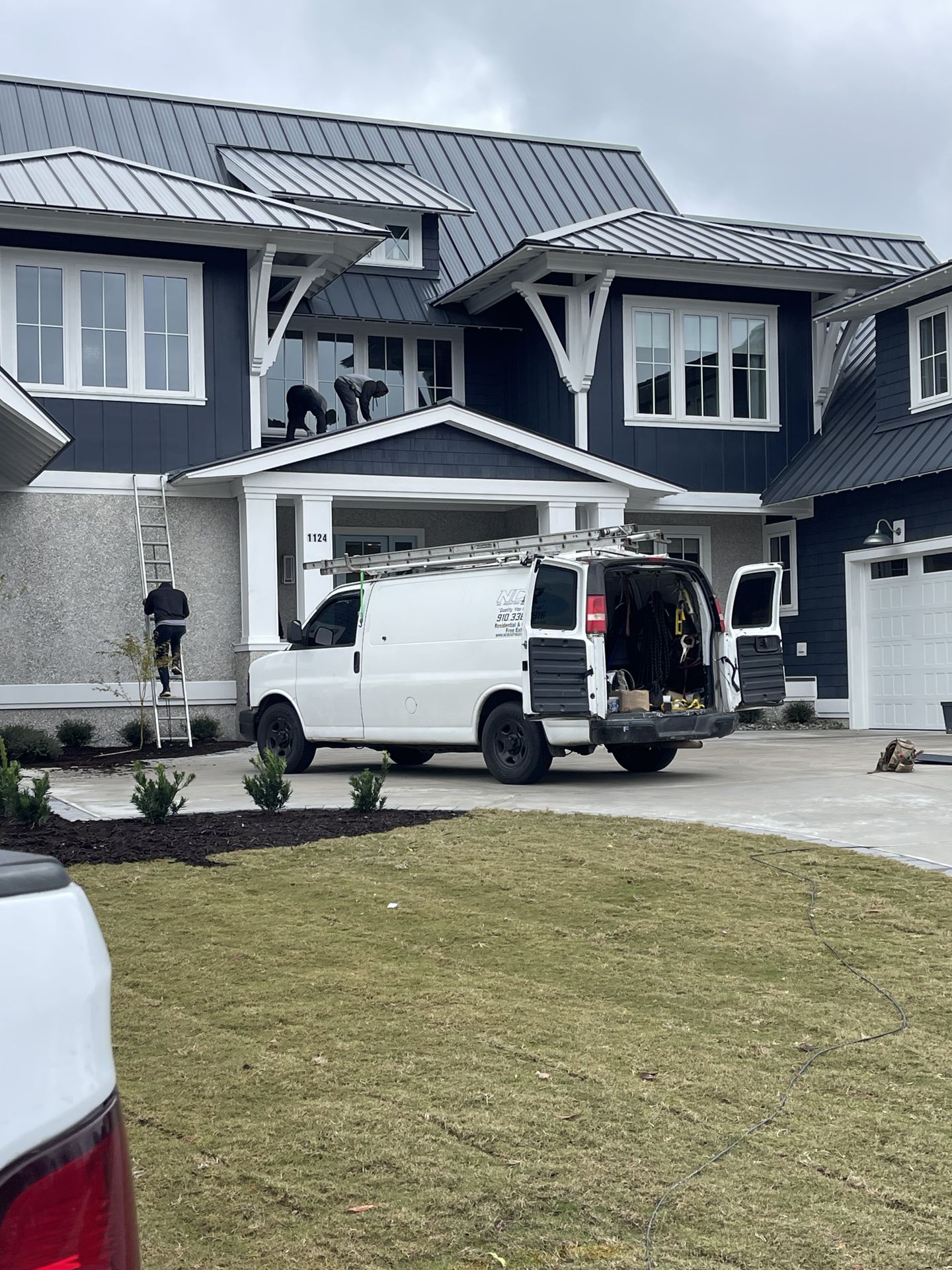 NC Roofing Company crew working on a residential installation