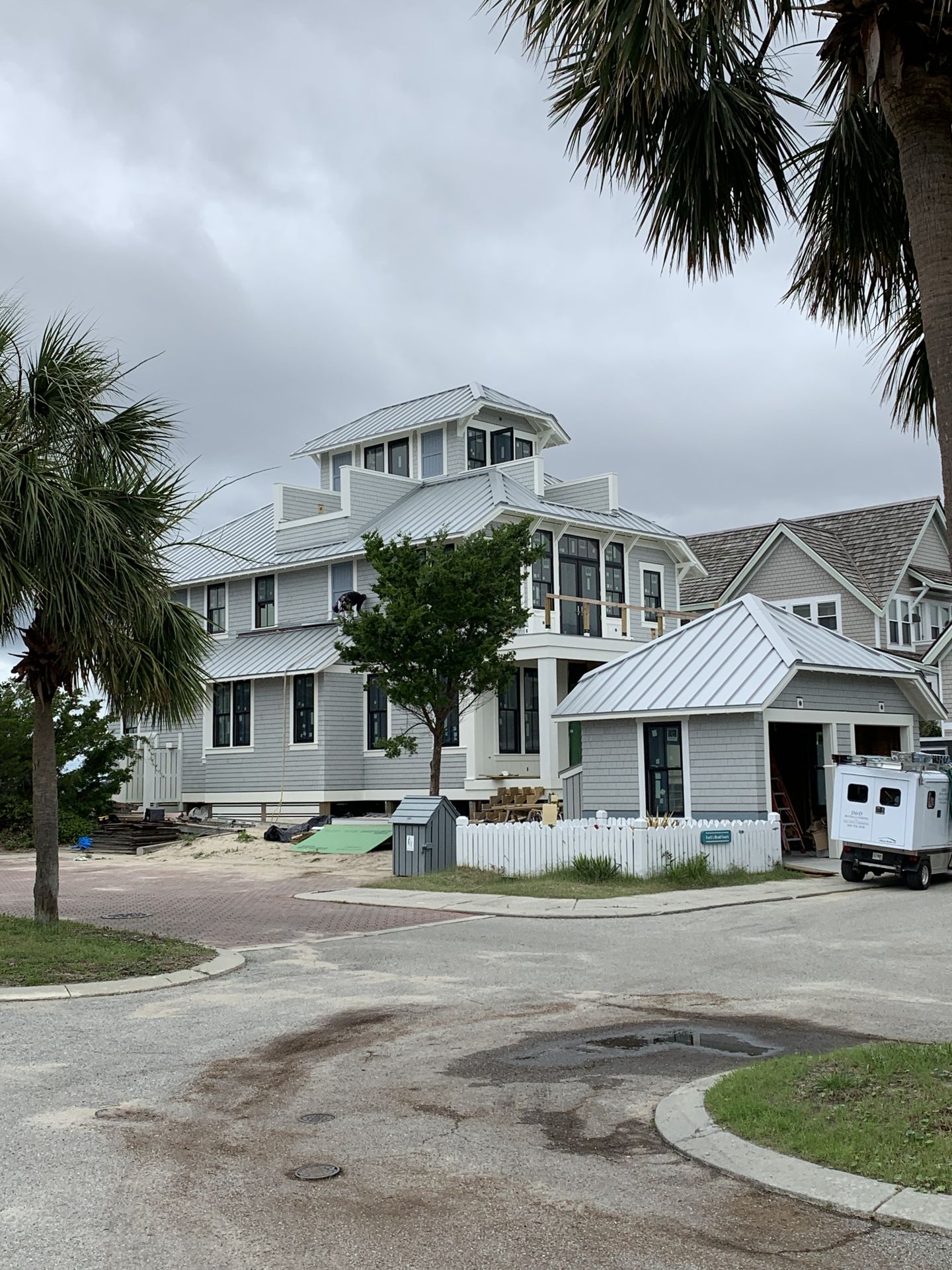 Three-story coastal home with completed roofing