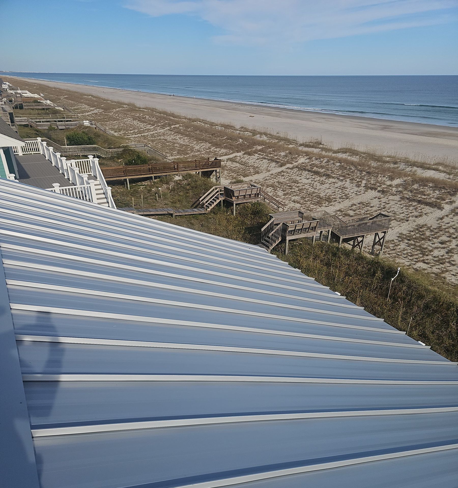 Standing seam metal roof on an oceanfront home overlooking the beach