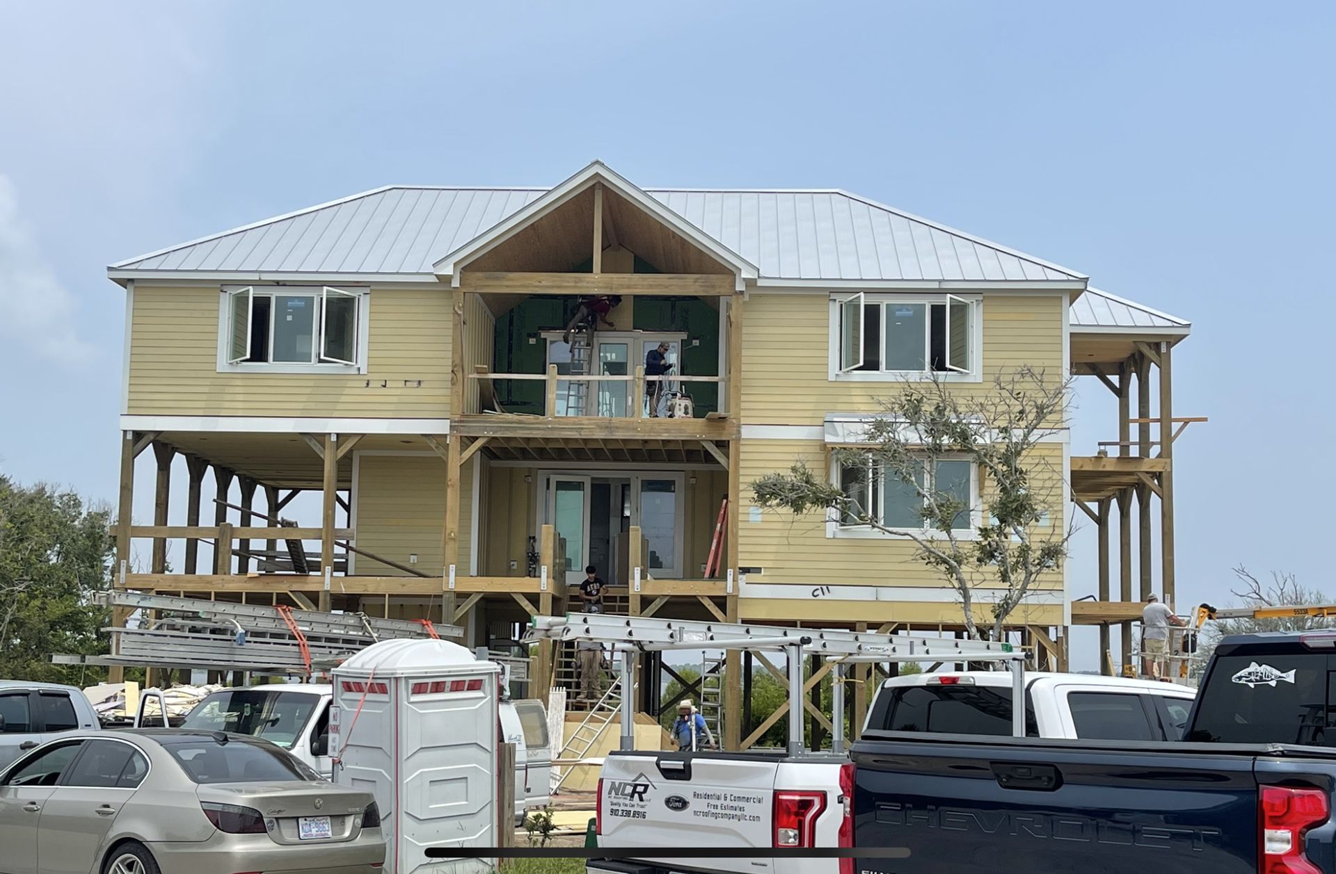 Elevated coastal home with completed roof