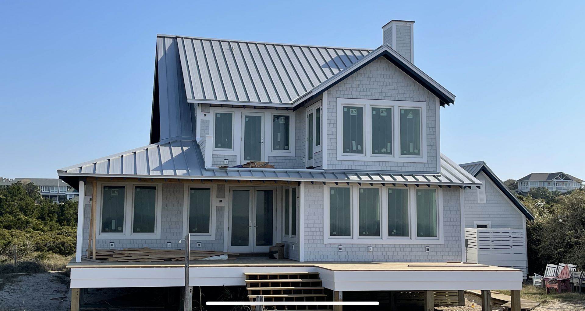 White home with completed metal roof