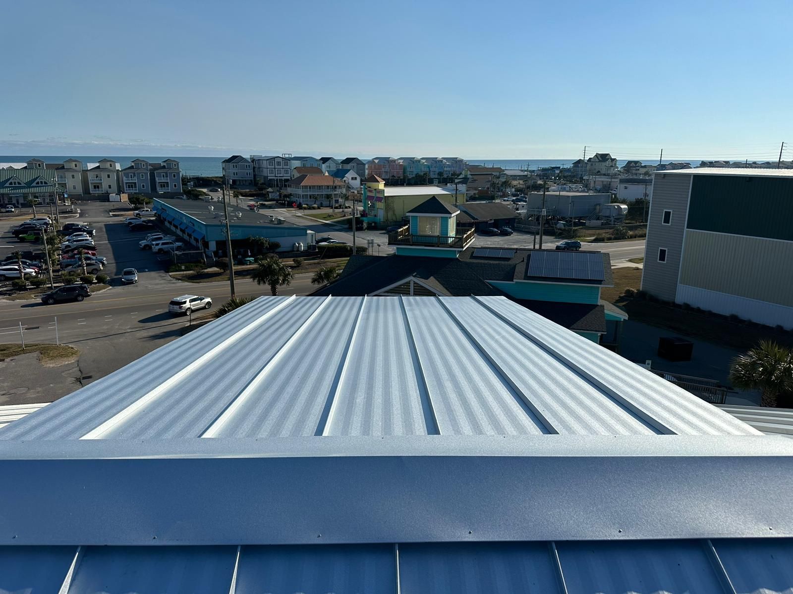 Close-up of a standing seam metal roof ridge in good condition