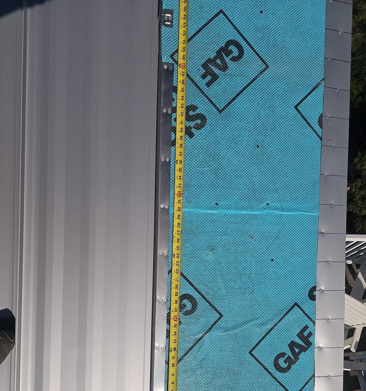 Roofing membrane and leak barrier installation in progress